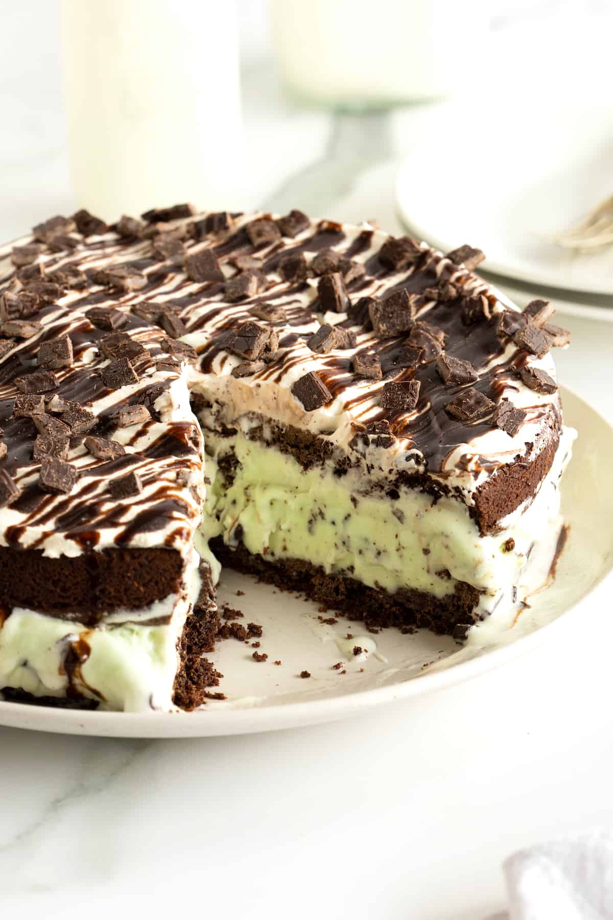 An ice cream cake made with mint chocolate chip ice cream and an Oreo crust.
